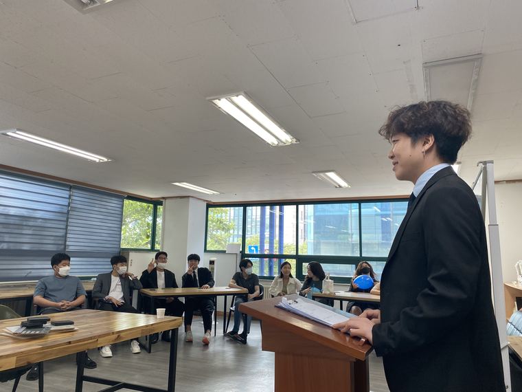 A student speaking at the podium
