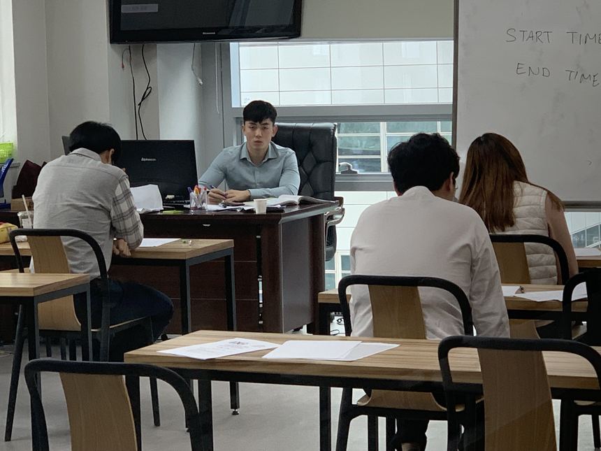 Timed writing under exam conditions at the college